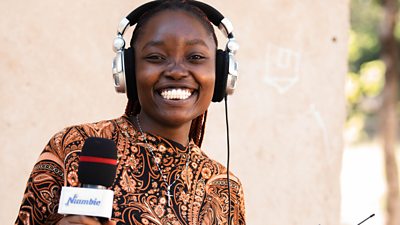 a Niambie reporter smiles for the camera
