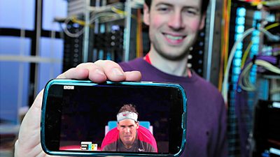 Man showing a phone to the camera