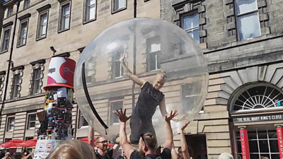 Woman inside a giant bubble