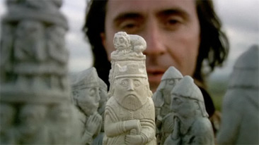 Neil Oliver with chess pieces